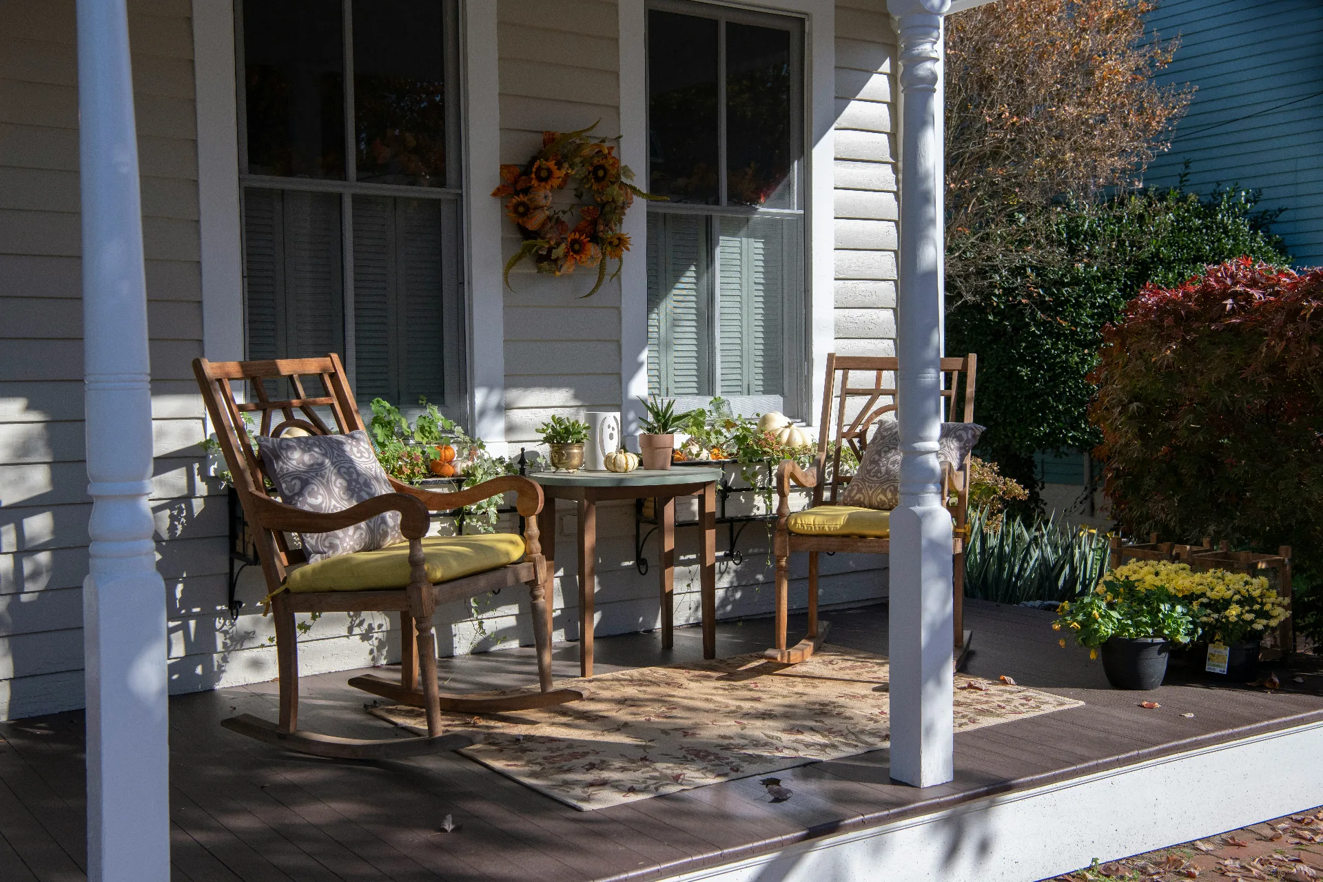 Beautifully decorated Southern porch with rocking chairs and seasonal accents